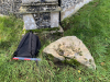 Boulder at north-east corner of church