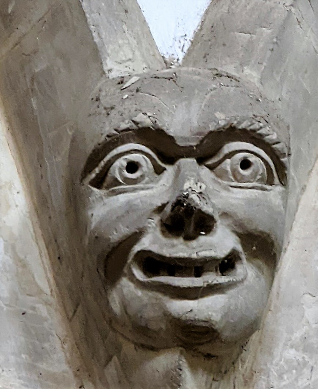 Wendens Ambo Church Carved Face with large eyes and open mouth Copyright: William George