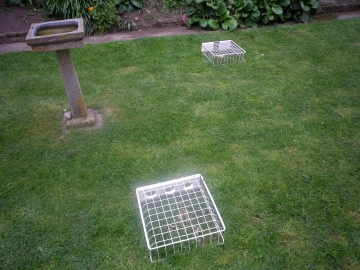 Redundant fridge drawers used as garden bird feeders Copyright: Michael Daniels