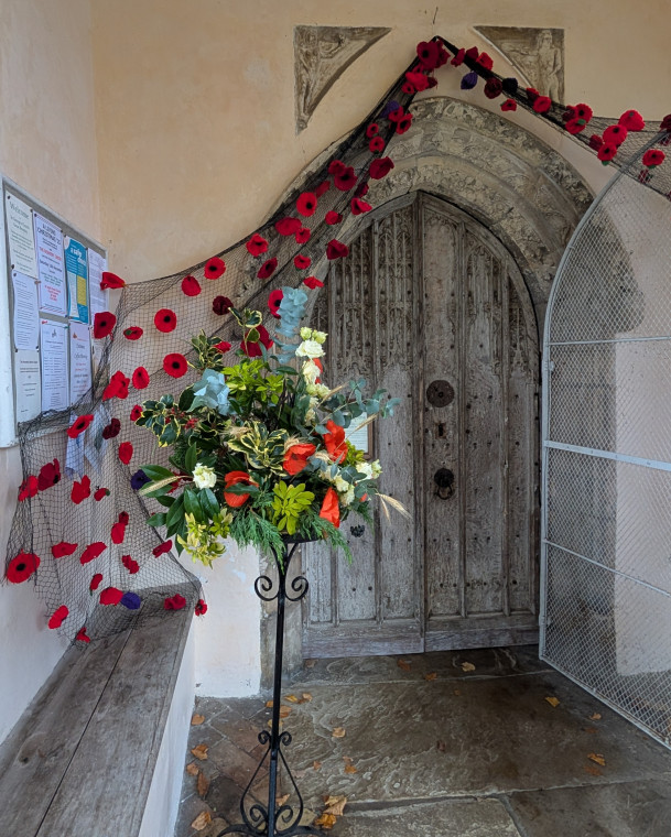 Great Bromley Church Porch with poppies and flowers 2025 Copyright: William George