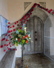 Great Bromley Church Porch with poppies and flowers 2025