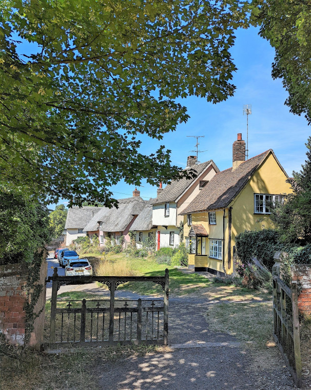 Wendens Ambo Cottages and church with trees 7 August 2022 Copyright: William George