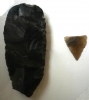 Typical Neolithic arrowhead and partly worked axe or celt 